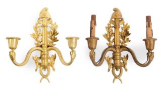 A PAIR OF FRENCH EMPIRE GILT BRONZE TWIN LIGHT WALL APPLIQUES