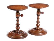 A PAIR OF LATE VICTORIAN WALNUT ADJUSTABLE CANDLESTANDS