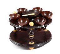 λ A REGENCY TREEN EBONY AND IVORY EGG CRUET