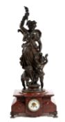A LARGE FRENCH ROUGE GRIOTTE AND PATINATED METAL MANTEL CLOCK