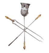 A SET OF THREE VICTORIAN POLISHED STEEL AND BRASS FIRE TOOLS