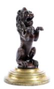A VICTORIAN CAST IRON MODEL OF A RAMPANT LION