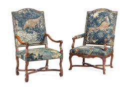 TWO SIMILAR FRENCH WALNUT AND VERDURE TAPESTRY ARMCHAIRS