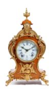 A CONTINENTAL GILT METAL MOUNTED MANTEL CLOCK