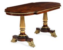 λ A REGENCY ROSEWOOD AND BRONZE MOUNTED LIBRARY TABLE
