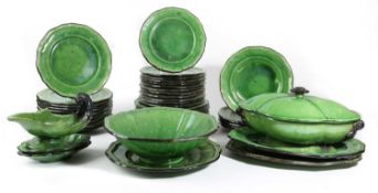 A FRENCH GREEN GLAZED POTTERY PART SERVICE