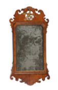 A GEORGE II WALNUT FRET-FRAME WALL MIRROR