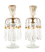 A PAIR OF REGENCY CUT GLASS AND BRASS MOUNTED CANDLESTICKS