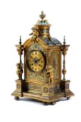 A FRENCH ORMOLU AND CHAMPLEVE ENAMEL MANTEL CLOCK