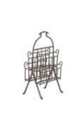 AN AESTHETIC MOVEMENT BRASS MAGAZINE RACK