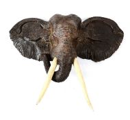 A VICTORIAN CARVED WOOD ELEPHANT HEAD WALL TROPHY
