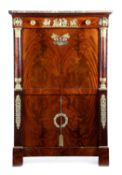 A FRENCH EMPIRE MAHOGANY AND ORMOLU MOUNTED SECRETAIRE A ABATTANT