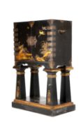 A JAPANESE BLACK LACQUER CABINET ON STAND