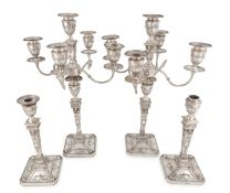 A matched pair of late-Victorian silver five-light candelabra and a pair of matching candlesticks,