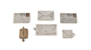 A collection of small silver stamp cases,