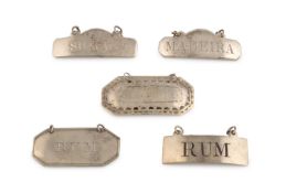 A collection of five antique Irish silver wine labels,