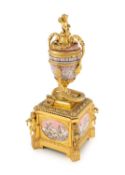 A late-19th century Austrian silver-gilt and pink enamel urn clock,