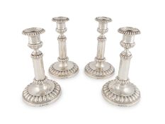 A set of four George III silver telescopic candlesticks,