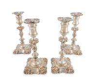 A matched set of four George III Old Sheffield plated candlesticks,