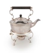 An electroplated kettle on stand,