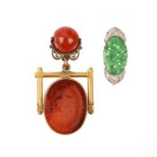 A CARNELIAN SPINNING FOB SEAL PENDANT AND AN ART DECO DIAMOND AND JADE BROOCH