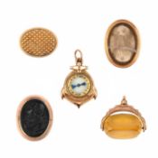 A COLLECTION OF FOUR GOLD FOB SEALS AND A GOLD COMPASS PENDANT