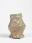 A GERMAN LATE MEDIEVAL GREY STONEWARE JUG