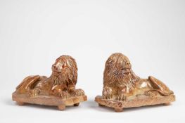 A MATCHED PAIR OF SALTGLAZED STONEWARE LIONS