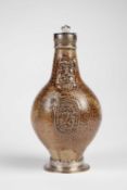 A SILVER MOUNTED GERMAN STONEWARE BELLARMINE OR BARTMANNSKRUG