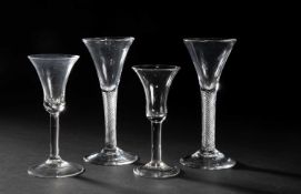 A NEAR PAIR OF WINE GLASSES