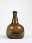 A SMALL GREEN GLASS WINE BOTTLE