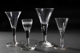 FOUR PLAIN STEMMED WINE GLASSES