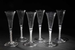 A SET OF SIX WINE GLASSES OR FLUTES
