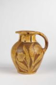 A NORTH DEVON SLIPWARE PUZZLE HARVEST JUG