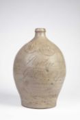 A LARGE GODSTONE 'IRON PEAR TREE' GOUT WATER BOTTLE