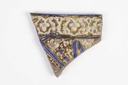 A KASHAN FRIEZE TILE FRAGMENT