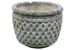 A weathered cast composition stone circular garden planter with decorative Celtic knot detail, 32 cm
