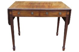 A 19th Century mahogany drop leaf side table raised on square tapered legs with spade feet, with