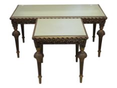 A pair of mid Century graduated occasional tables with decorative gilt frames and mirror panelled