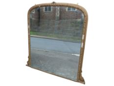 A large 19th century gilt-framed wall mirror of arched form, 130 x 110cm