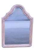 A contemporary shield shaped wall mirror with moulded arch frame, 89 cm x 62 cm
