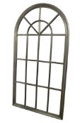 A large contemporary wall mirror in the form of a Georgian arched window, 171 cm x 9-0 cm