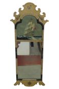 A Chippendale style wall mirror with fret carved outline and painted frame with galleon detail,