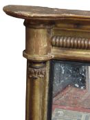 A Regency gilt framed overmantel mirror enclosing 3 plates with reeded slips and split column