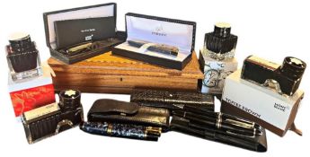 A collection of various writing equipment to include a Montblanc cased Meisterstuck fountain pen/