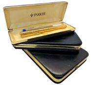 A cased Parker pen and two refills, together with two leather pen cases