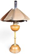 Attributed to W.A.S Benson (British, 1854-1924) a copper and brass table/ reading lamp with '