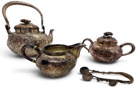 A fine Japanese silver four piece tea set, comprising bulbous teapot of squat gourd form, twin-