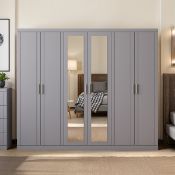 Boxed KIMBERLEY 6 Door Wardrobe With Mirror Grey RRP £789.99. Redefine your bedroom storage with the