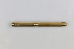 Sampson Mordan & Co, an antique yellow metal propelling pencil with reeded body and removable end